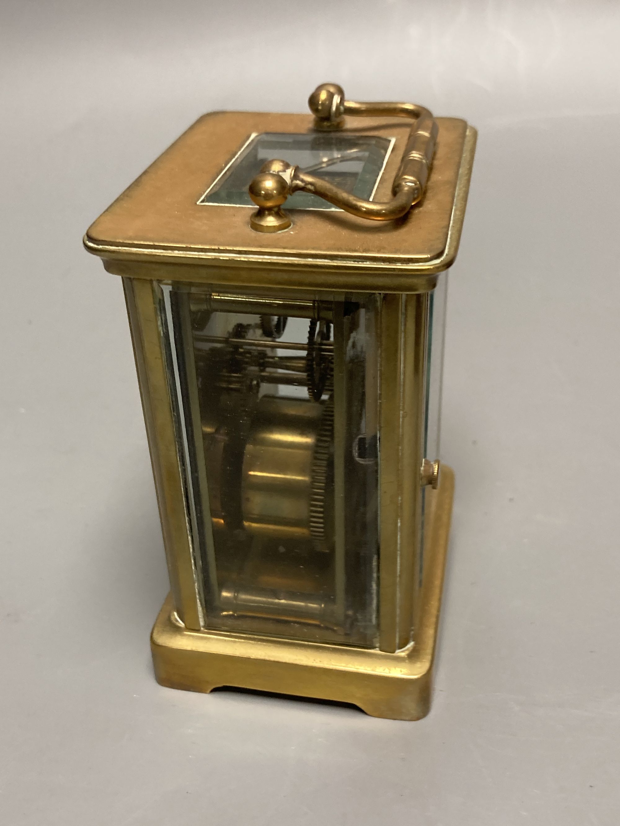 A French brass carriage timepiece, by F.L. Chandler, height 11cm, box 13cm
